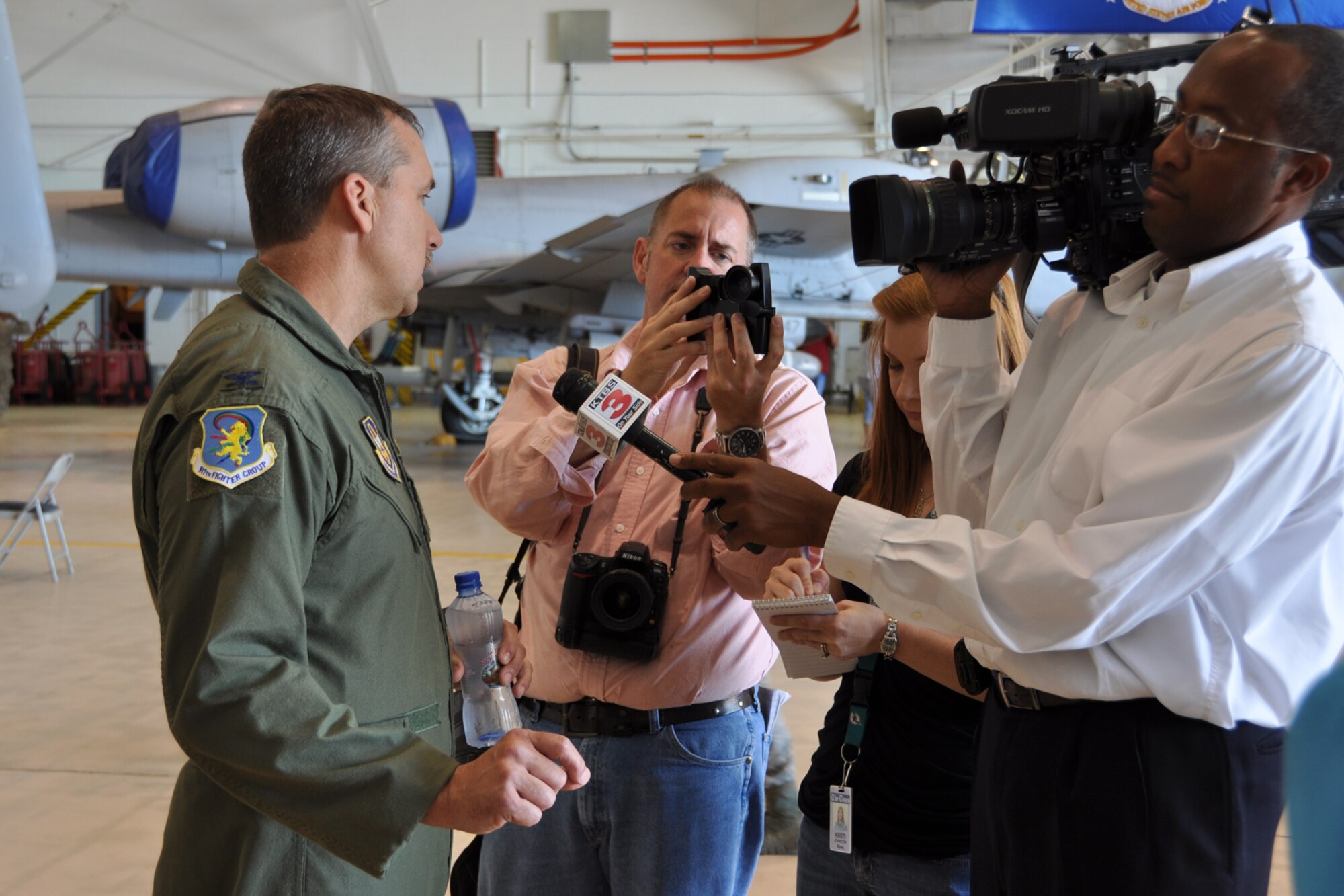 Col. John Breazeale, the commander of the 971th Fighter Group, speaks with members of the media after welcoming home the final deployed members of the 917th FG at Barksdale Air Force Base, La., April 17, 2012. A C-17 Globemaster III from the 436th Airlift Wing, Dover Air Force Base, Del., carried the final 47 Airmen from the 917 FG who were deployed to Afghanistan. (U.S. Air Force photo by Master Sgt. Jeff Walston)   