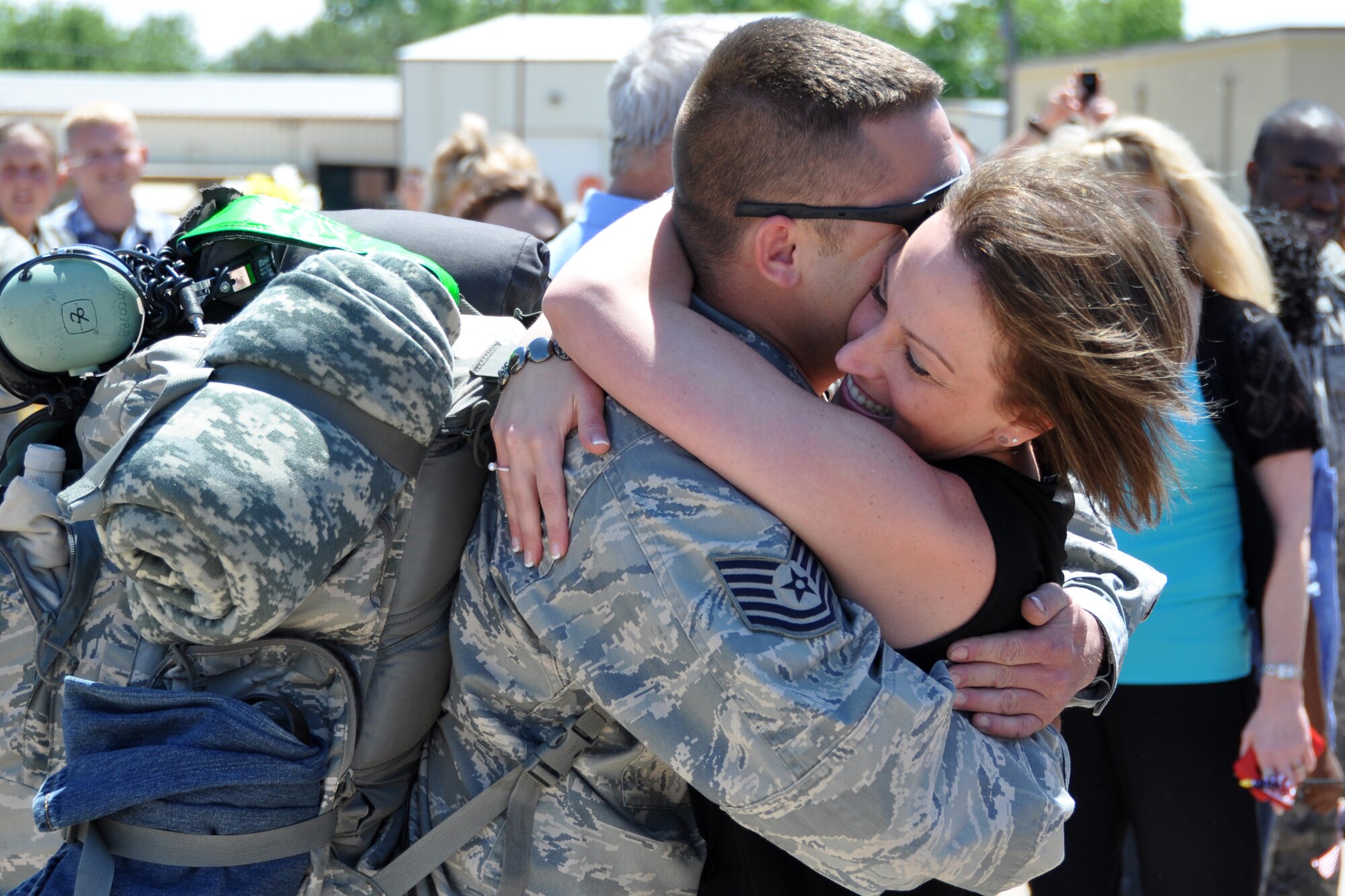 Tech. Sgt. Keith Miner, a crew chief assigned to the 917th Fighter Group, receives a welcome hug from his soon to be fiancé, Miranda O’Dell at Barksdale Air Force Base, La., April 17, 2012. Miner proposed to O’Dell in front of the crowd of well wishers and numerous media after his deployment to Afghanistan. O’Dell said “yes.” (U.S. Air Force photo by Master Sgt. Jeff Walston)  