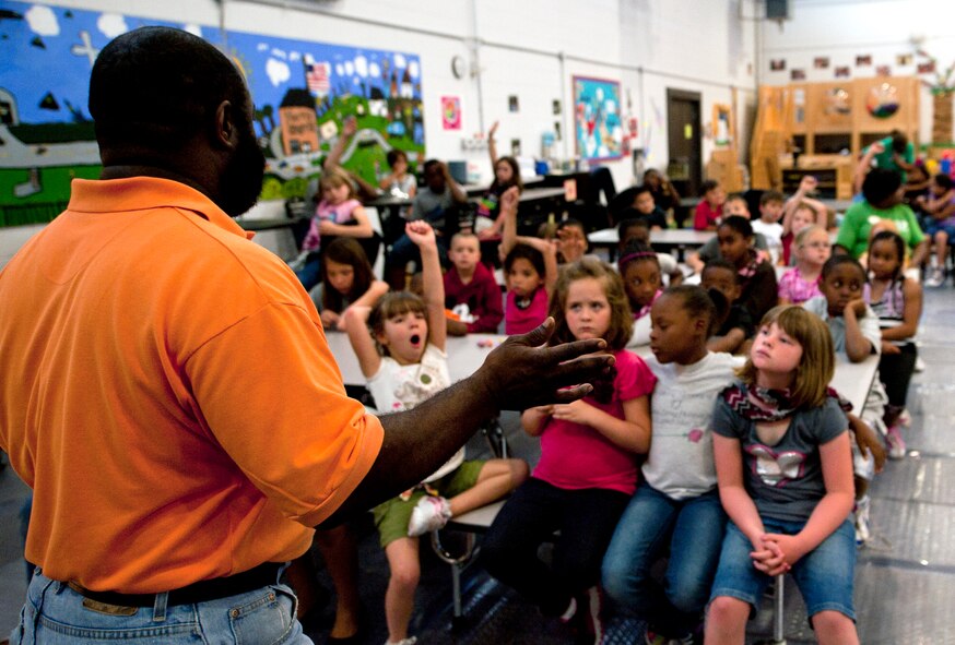 Elvis Lane, 23d Civil Engineer Squadron environmental specialist, speaks to children about energy conservation April 18, 2012 at the youth center on Moody Air Force Base, Ga. Moody held events all week to recognize Earth Week which is April 16 to 22, to educate people about sustaining our environment. (U.S. Air Force photo by Airman 1st Class Jarrod Grammel/Released)
