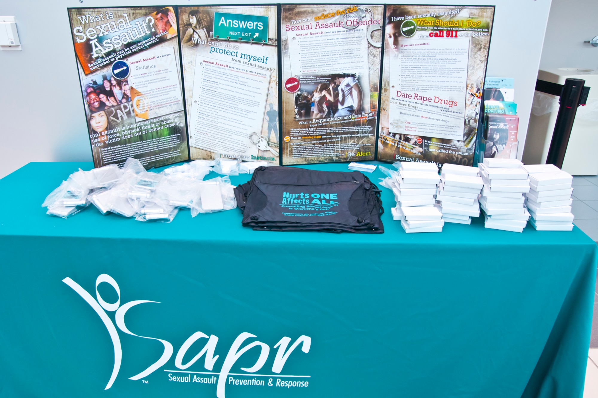 A Sexual Assault Awareness Month table designed to raise awareness about sexual assault and its effects on Department of Defense members is displayed in the entrance to the base headquarters building during the month of April, here.