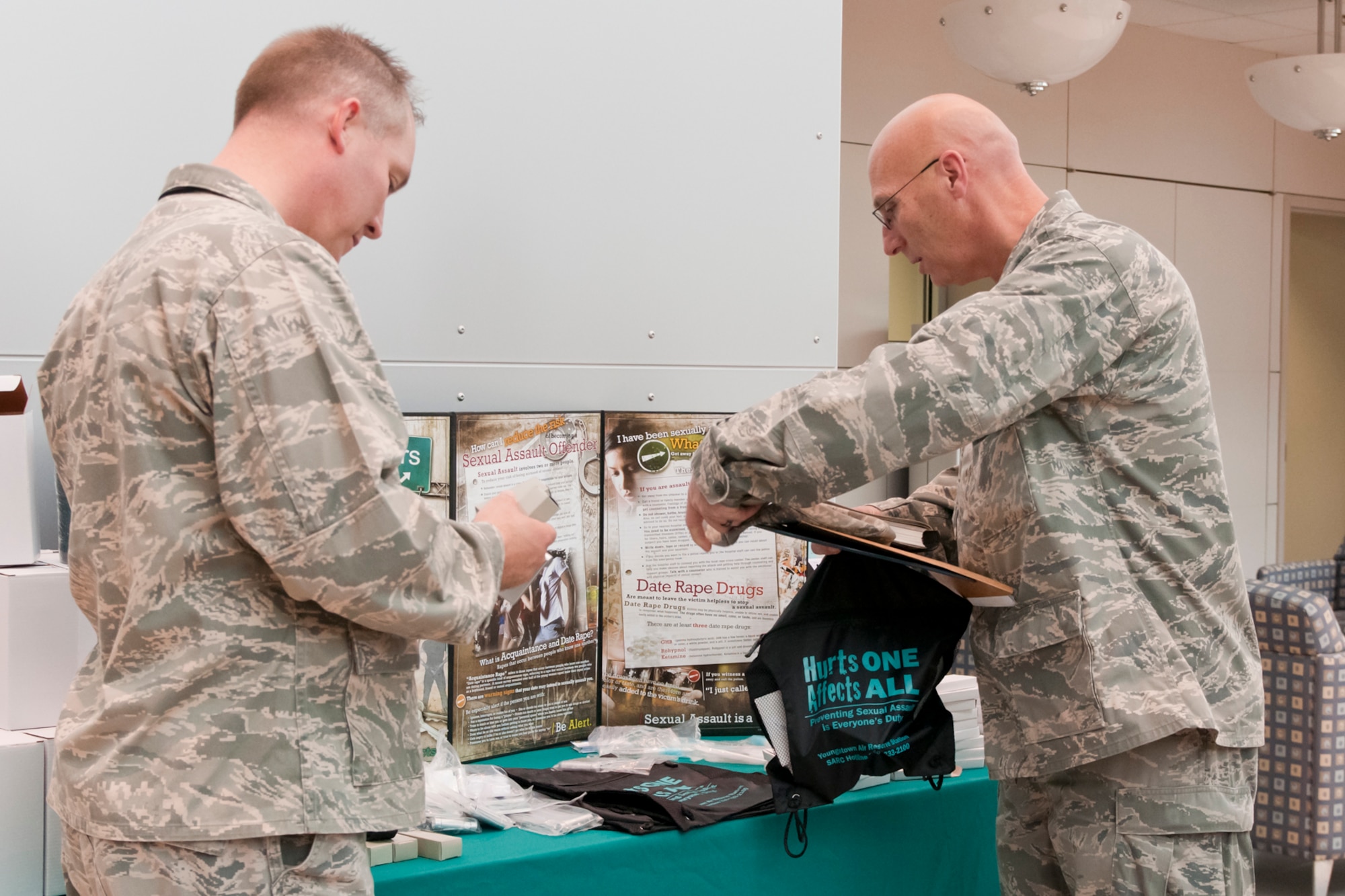 YARS members select promotional materials from the Sexual Assault Awareness Month table, here, April 15.