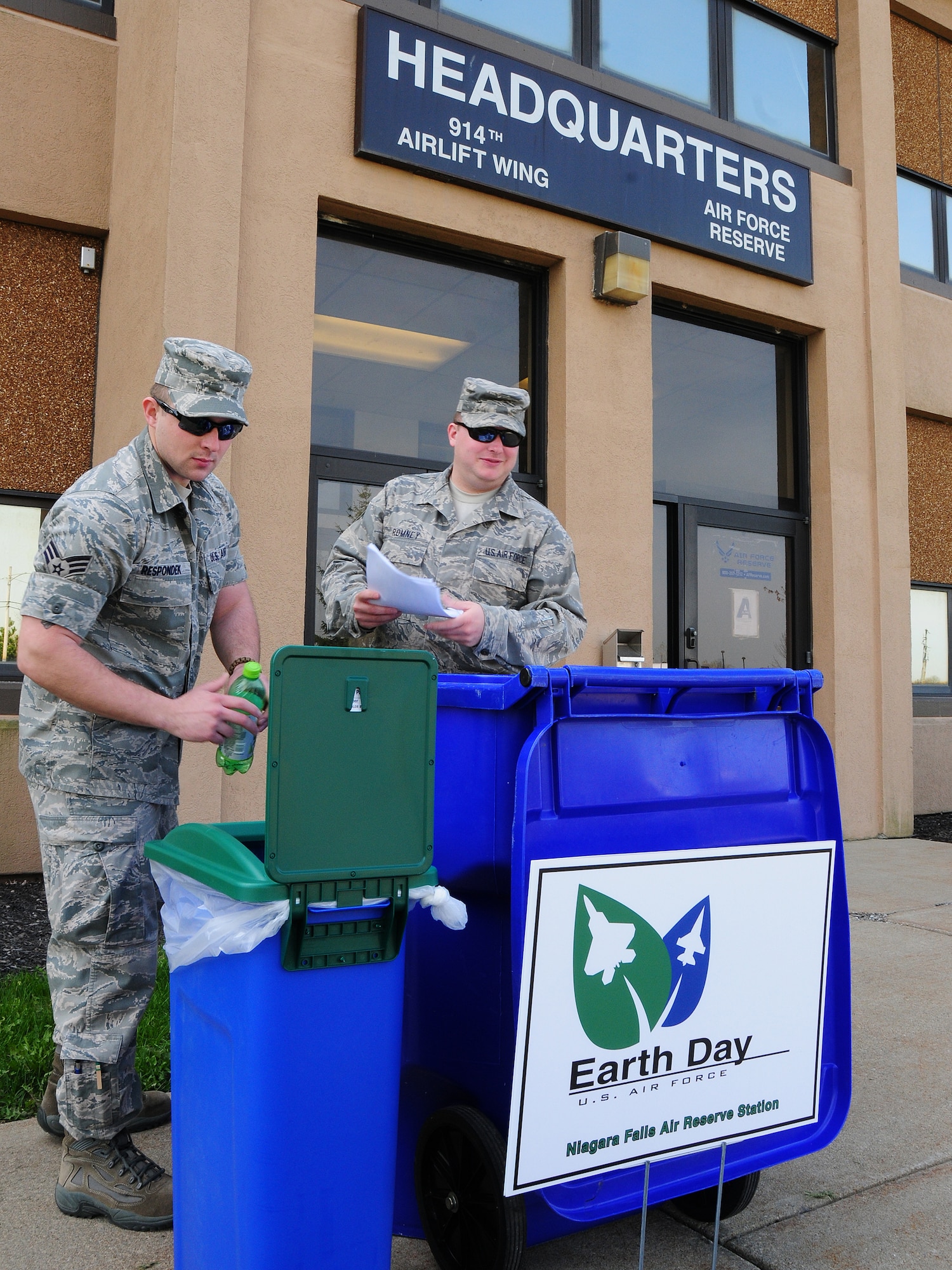 Senior Airman Nick Respondek, 914th Airlift Wing public affairs knowledge operations manager (left) and Staff Sgt. Jordan Romney, 914th Mission Support Group command support staff do their part to recycle at Niagara Falls Air Reserve Station, NY on April 20, 2012. Earth Day officially is April 22, but members at Niagara ARS participate in many recycling programs throughout the year. (U.S. Air Force photo by Peter Borys)