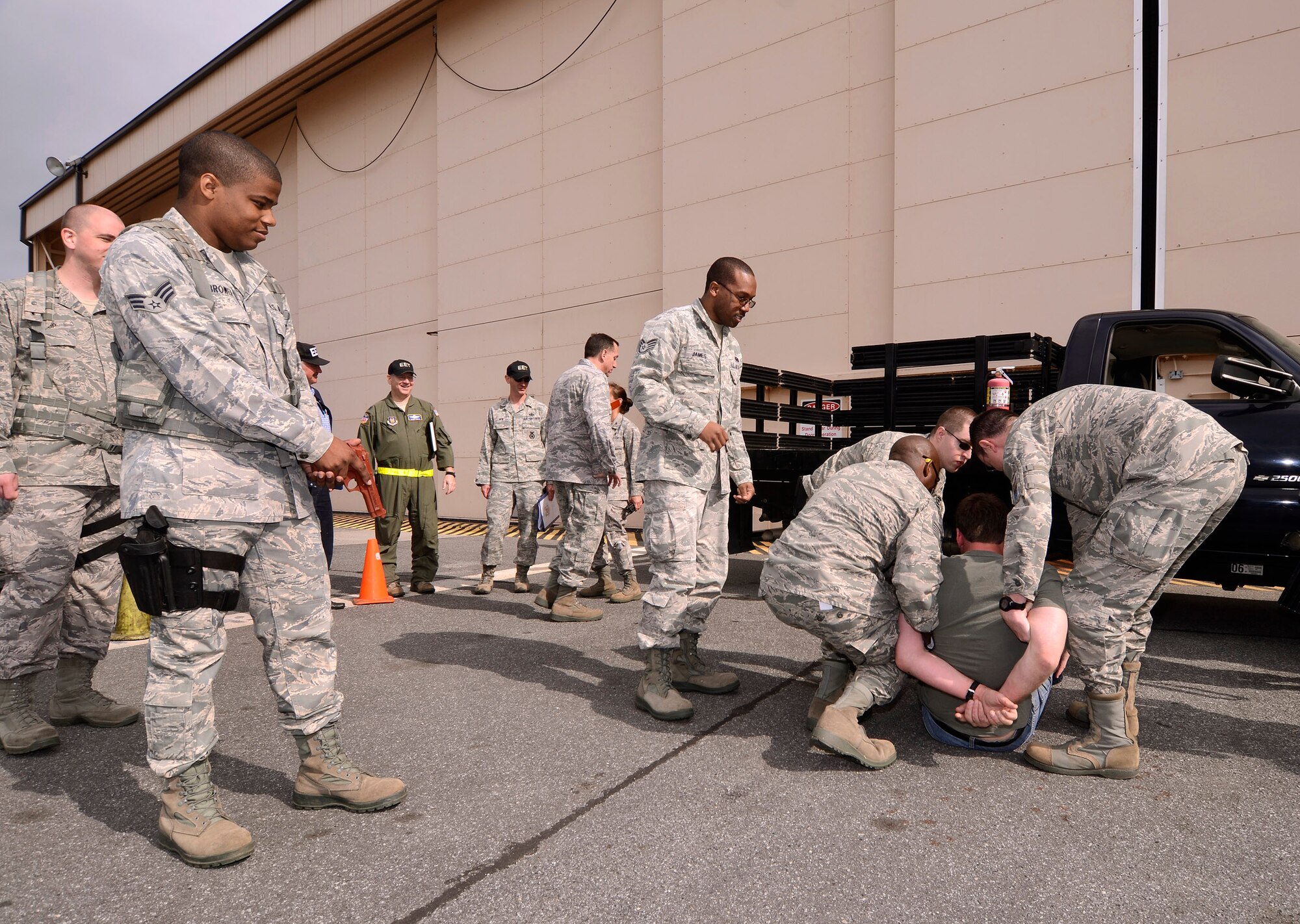 94th Aeromedical Staging Squadron personnel secure a patient after he was found to be armed while processing into the Contingency Aeromedical Staging Facility during a mass casualty exercise at Dobbins Air Reserve Base, Ga., Apr. 15.  The exercise tested the ability of the Georgia State Defense Force to work with 94th Airlift Wing military personnel in treating and evacuating natural disaster victims from the Atlanta area.  (U.S. Air Force photo/ Brad Fallin)