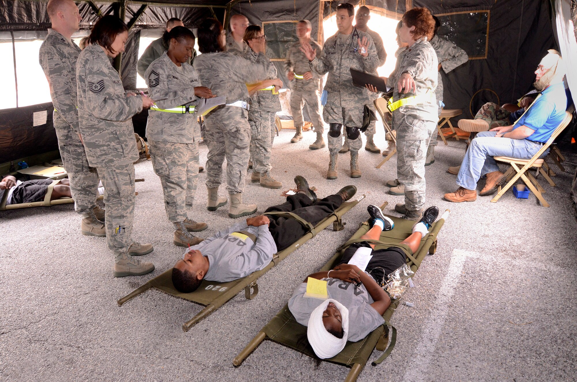 94th Aeromedical Staging Squadron personnel keep patients stable and comfortable while they await transportation in the Contingency Aeromedical Staging Facility, during a mass casualty exercise at Dobbins Air Reserve Base, Ga., Apr. 15.  The exercise tested the ability of the Georgia State Defense Force to work with 94th Airlift Wing military personnel in treating and evacuating natural disaster victims from the Atlanta area.  (U.S. Air Force photo/ Brad Fallin)