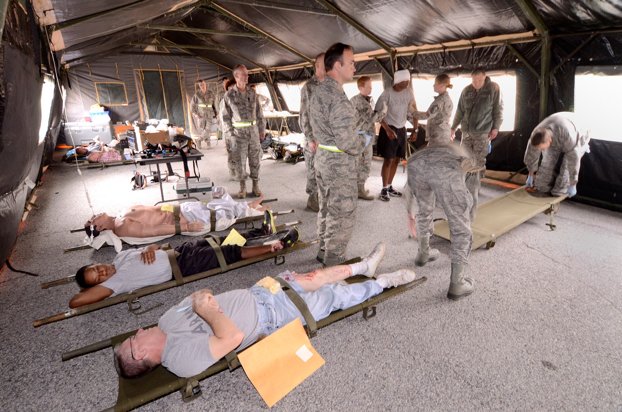 94th Aeromedical Staging Squadron personnel keep patients stable and comfortable while they await transportation in the Contingency Aeromedical Staging Facility, during a mass casualty exercise at Dobbins Air Reserve Base, Ga., Apr. 15.  The exercise tested the ability of the Georgia State Defense Force to work with 94th Airlift Wing military personnel in treating and evacuating natural disaster victims from the Atlanta area.  (U.S. Air Force photo/ Brad Fallin)