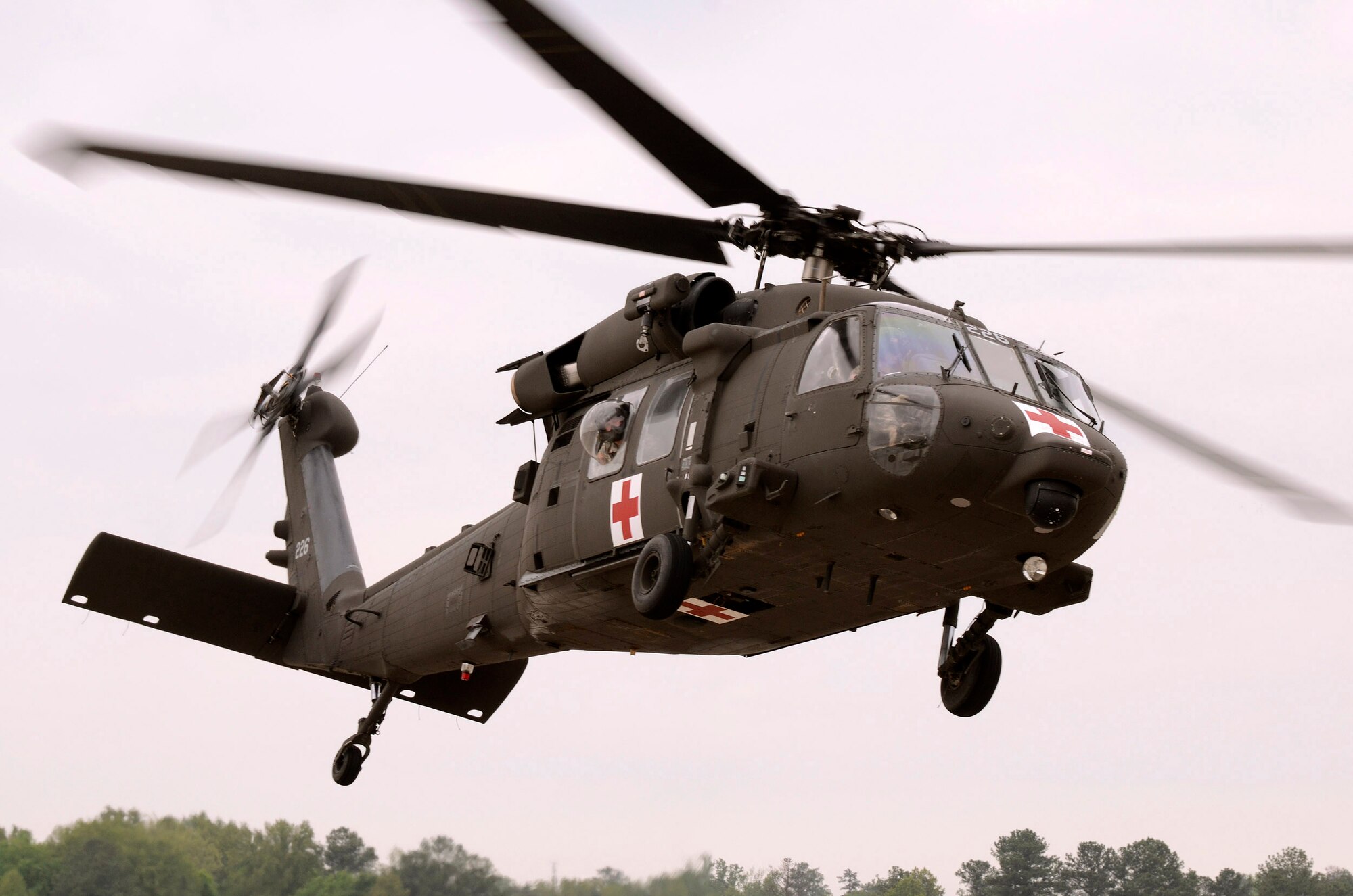 A Georgia Army National Guard UH-60 Blackhawk helicopter lifts off with another patient during a mass casualty exercise at Dobbins Air Reserve Base, Ga., Apr. 15.  The exercise tested the ability of the Georgia State Defense Force to work with 94th Airlift Wing military personnel in treating and evacuating natural disaster victims from the Atlanta area.  (U.S. Air Force photo/ Brad Fallin)