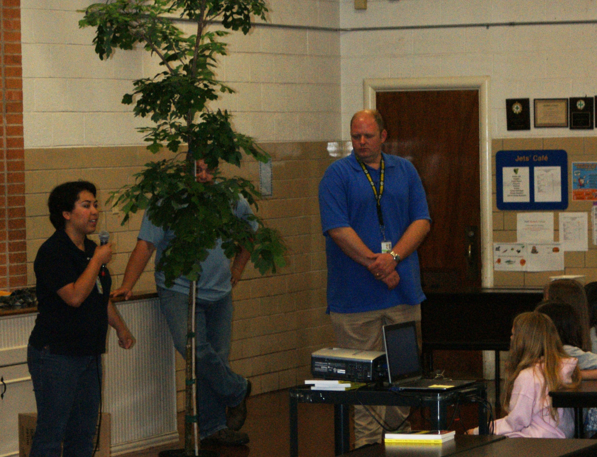 Leslie Pena of Defense Support Service presents a burr oak tree to Sheppard Elementary School during an Earth Day celebration April 20, 2012. The event was held to celebrate  Earth Day. (U.S. Air Force photo/Kimberly Dagdag)  