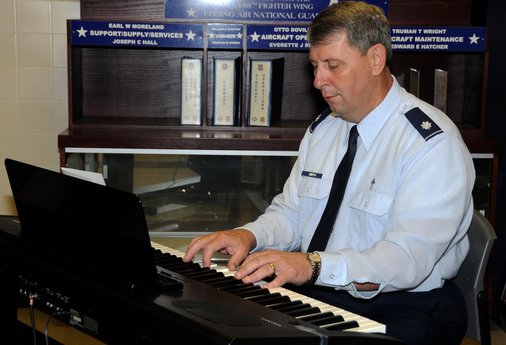 Lt. Col. Tom Smith, 188th Fighter Wing chaplain, performs a song during a prayer breakfast hosted by the 188th Chaplains Office and held at the unit’s Citizen Airmen Dining Hall April 15, 2012. (National Guard photo by Airman 1st Class Hannah Landeros/188th Fighter Wing Public Affairs)
