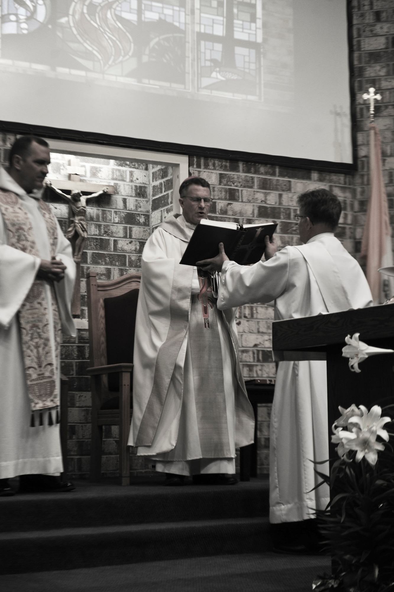 Archbishop Timothy Broglio, Archdiocese for Military Services, USA, leads a closing prayer during Confirmation Mass at Moody Air Force Base, Ga., April 16, 2011. Confirmation is the another symbolic ceremony Catholics take part in during their religious journey.  (U.S. Air Force Photo by Airman 1st Class Paul Francis/Released)
