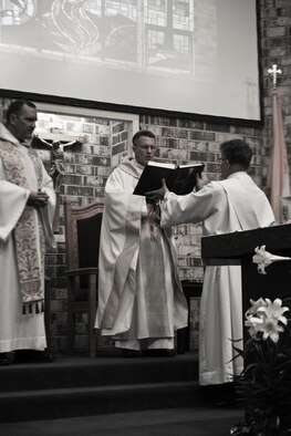 Archbishop Timothy Broglio, Archdiocese for Military Services, USA, leads a closing prayer during Confirmation Mass at Moody Air Force Base, Ga., April 16, 2011. Confirmation is the another symbolic ceremony Catholics take part in during their religious journey.  (U.S. Air Force Photo by Airman 1st Class Paul Francis/Released)
