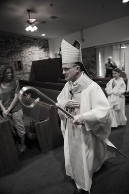 Archbishop Timothy Broglio, Archdiocese for Military Services, USA, takes part in an entrance procession during Confirmation Mass at Moody Air Force Base, Ga., April 16, 2012.  The purpose of Broglio’s visit was to meet with the community as well as perform the sacrament of conformation.  (U.S. Air Force Photo by Airman 1st Class Paul Francis/Released)
