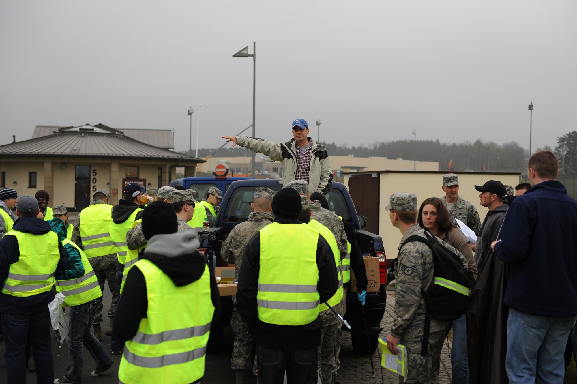 SPANGDAHLEM AIR BASE, Germany – Tech. Sgt. Damon Weigl, 52nd Civil Engineer Squadron structural craftsman and adopt a highway coordinator, organizes 52nd Fighter Wing volunteers into groups at the base visitor center parking lot April 20. Base members cleaned up roads surrounding the base, mainly along the L-46 and B-50, as part of an Earth Day initiative. The 52nd CES is partnering with other base organizations and the local community to conserve natural resources, minimize waste and prevent pollution by hosting several Earth Day events on and off base. (U.S. Air Force photo by Airman 1st Class Matthew B. Fredericks/Released)