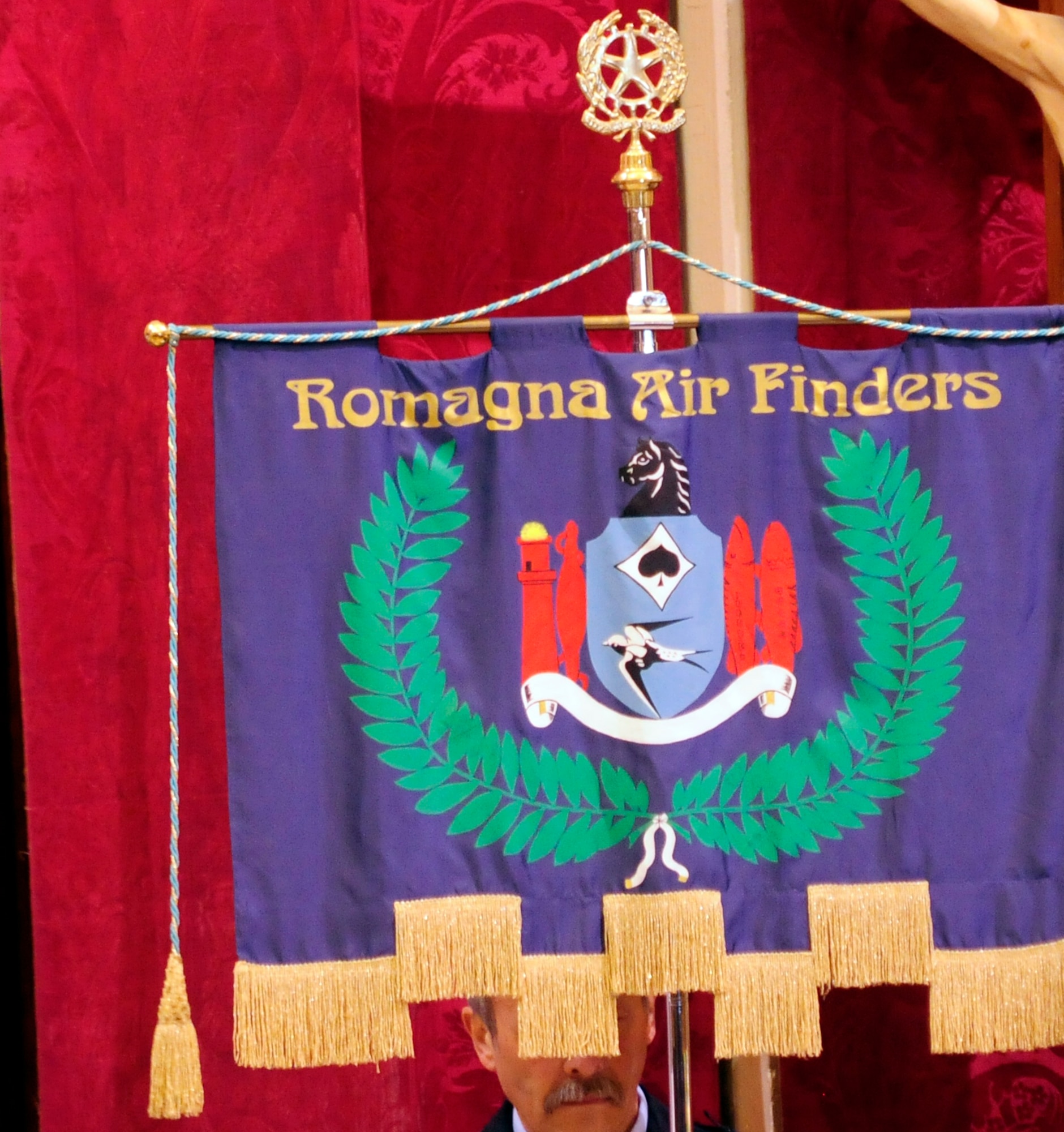 The Romagna Air Finders banner is presented during a remembrance ceremony for Maj. Hugh Muse, Jr. on April 14 at Vighizzolo D’Este, Italy. The Romagna Air Finders discovered Muse’s remains in 2008, nearly 65 years after he was shot down during a bombing mission over Northern Italy. (U.S. Air Force photo/Airman 1st Class Briana Jones)