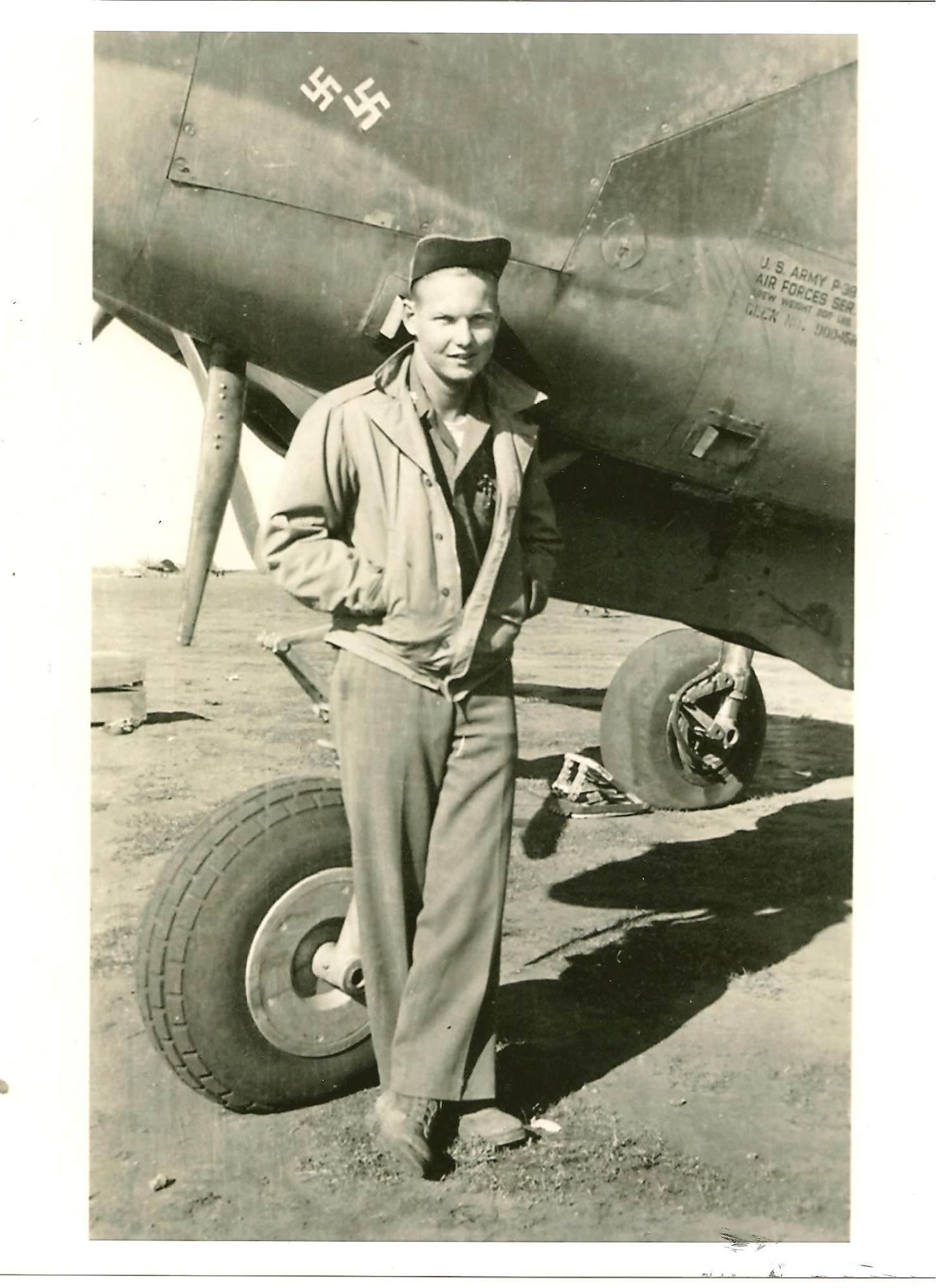 Maj Hugh Muse, Jr., stands by an aircraft in this undated photograph. Muse, a World War II pilot, was shot down during a mission over Northern Italy on Dec. 25, 1943. (Courtesy Photo)

