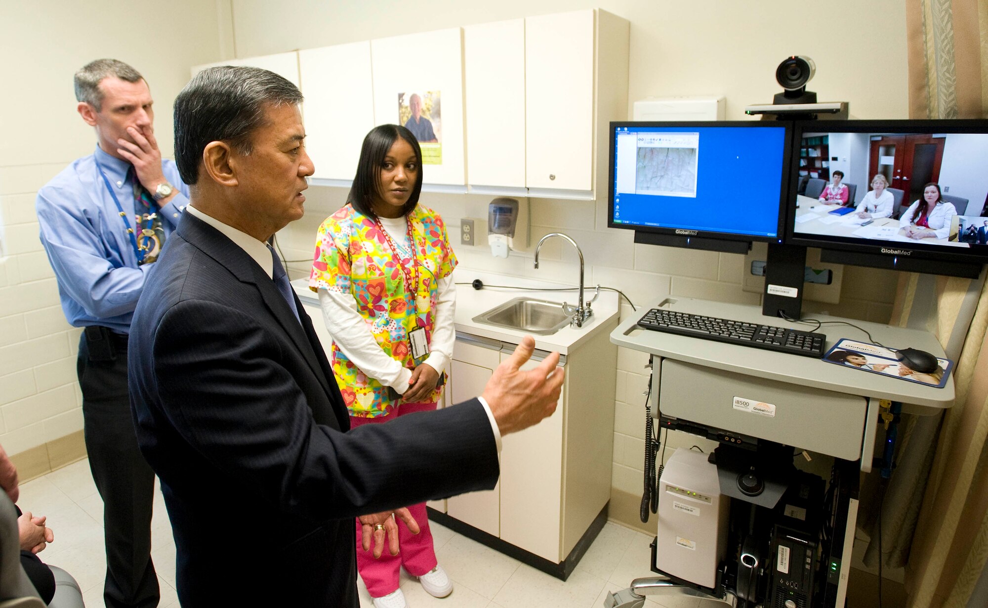 Erik K. Shinseki, Secretary of the U.S. Department of Veterans Affairs, speaks to physicians in Philadelphia April 13 from the Community Based Outpatient Clinic here via the clinic’s new Telehealth system during a tour of the facility. Shinseki said on-site visits like this one are critical to helping him understand how his department can better serve its growing veteran populations. (Photo by Scott Snell/Released)