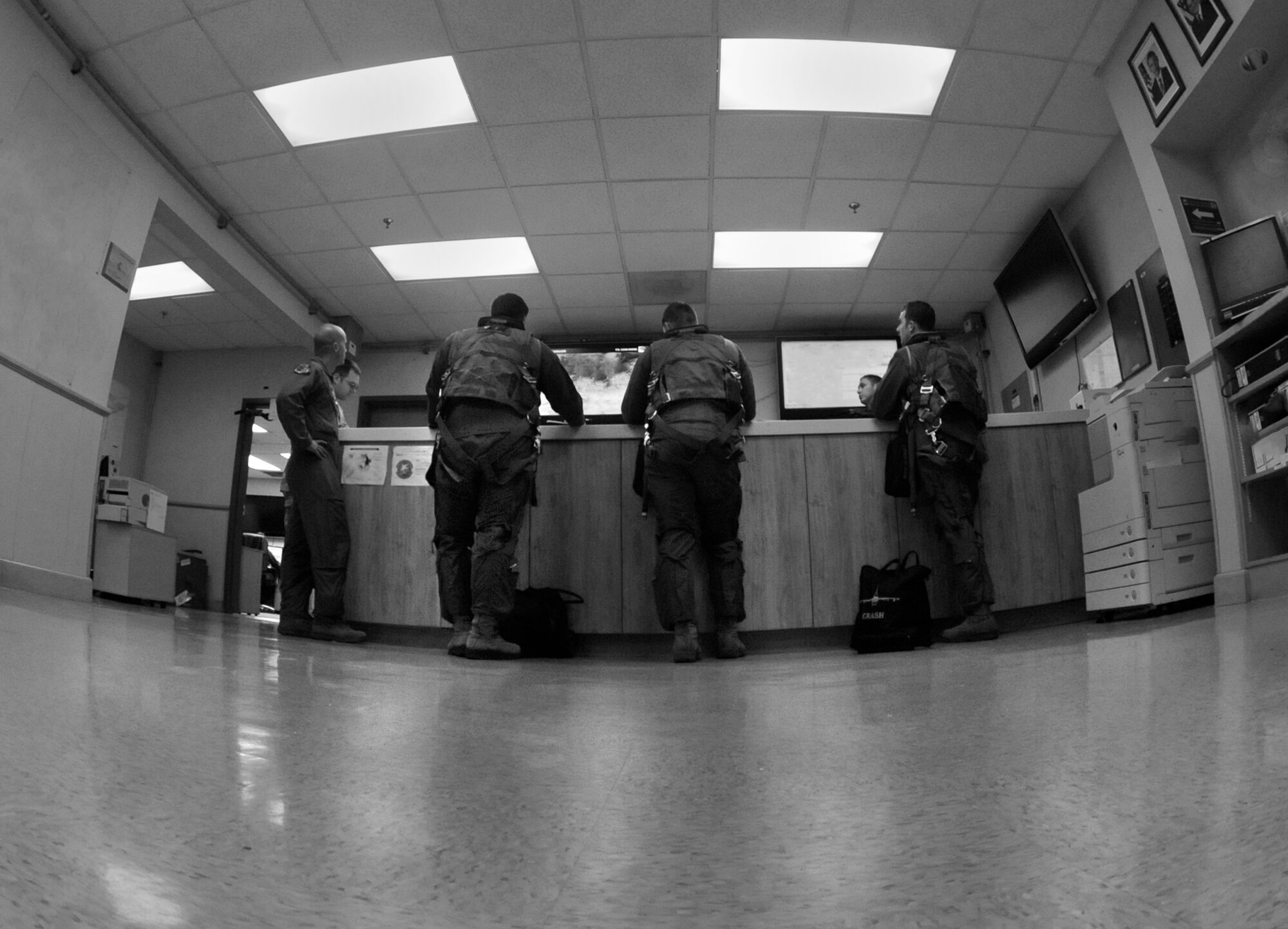Pilots from the 80th Fighter Squadron take notes during a “step briefing” before a routine F-16 training mission at Kunsan Air Base, Republic of Korea, April 19, 2012. Day-to-day operations continue throughout the Wolf Pack as Pacific Air Force Inspector General team members begin wrapping-up their compliance section review of the Wolf Pack. (U.S. Air Force illustration/Senior Airman Jessica Hines)  