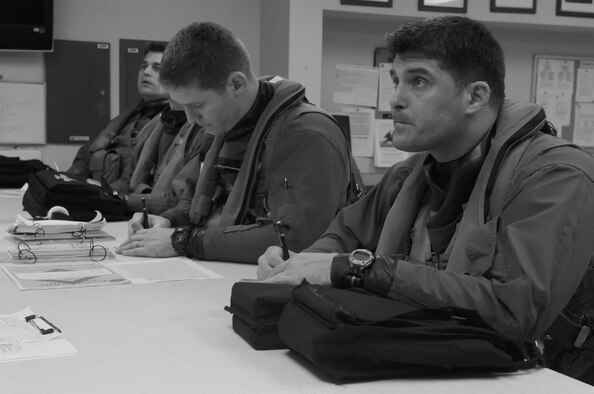 Maj. Brett Rurka, right, 8th Fighter Wing inspector general, and pilots from the 80th Fighter Squadron take notes during a “step briefing” before a routine F-16 training mission at Kunsan Air Base, Republic of Korea, April 19, 2012. During the 8th Fighter Wing’s Consolidated Unit Inspection, day-to-day operations went as scheduled as 120 inspectors from the Pacific Air Force IG began wrapping-up their compliance section review of the Wolf Pack. (U.S. Air Force illustration/Senior Airman Jessica Hines)  