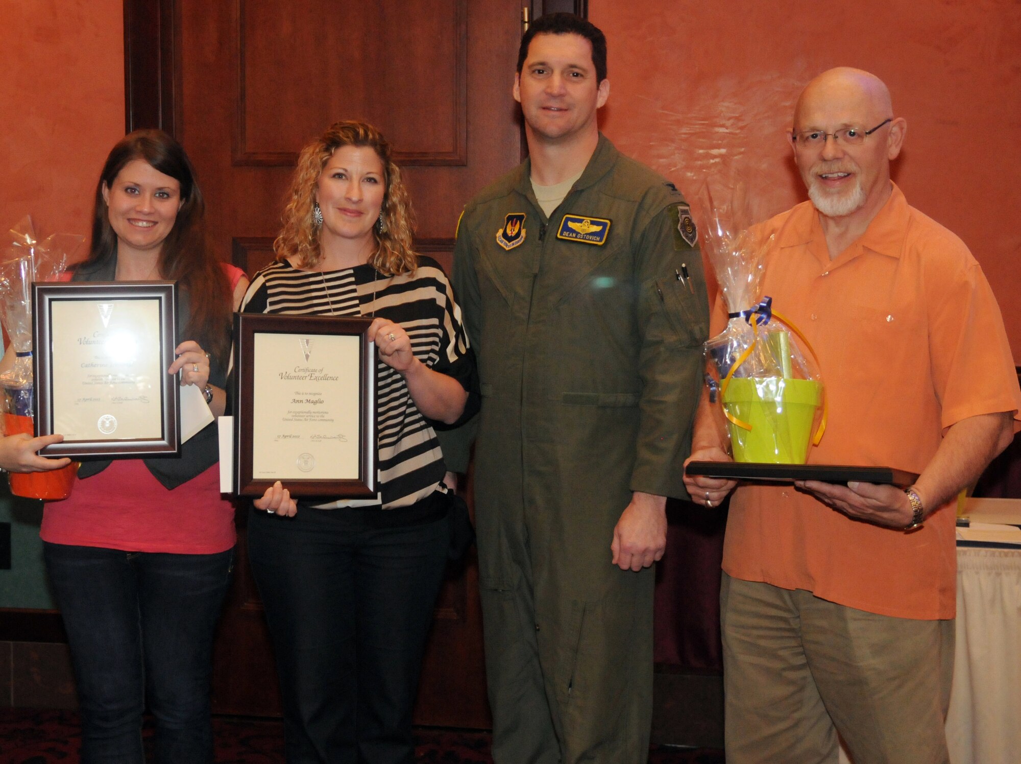 Col. Dean Ostovich, 31st Fighter Wing vice commander, poses with the 31st FW's 2011 Volunteer Excellence Award winners at the annual Volunteer Appreciation Ceremony April 17 at Aviano Air Base, Italy. The recipients (from left) are Catherine Jennings, Ann Maglio, Chuck Whittlesey and Amy Neibuhr (not pictured). The Volunteer Excellence Award recognizes exceptional individuals who volunteered with an agency or organization in a sustained, direct and consequential nature. It is a lifetime achievement award from the Chief of Staff of the Air Force and can only be received once. (U.S. Air Force photo/Airman 1st Class Jenay Randolph) 