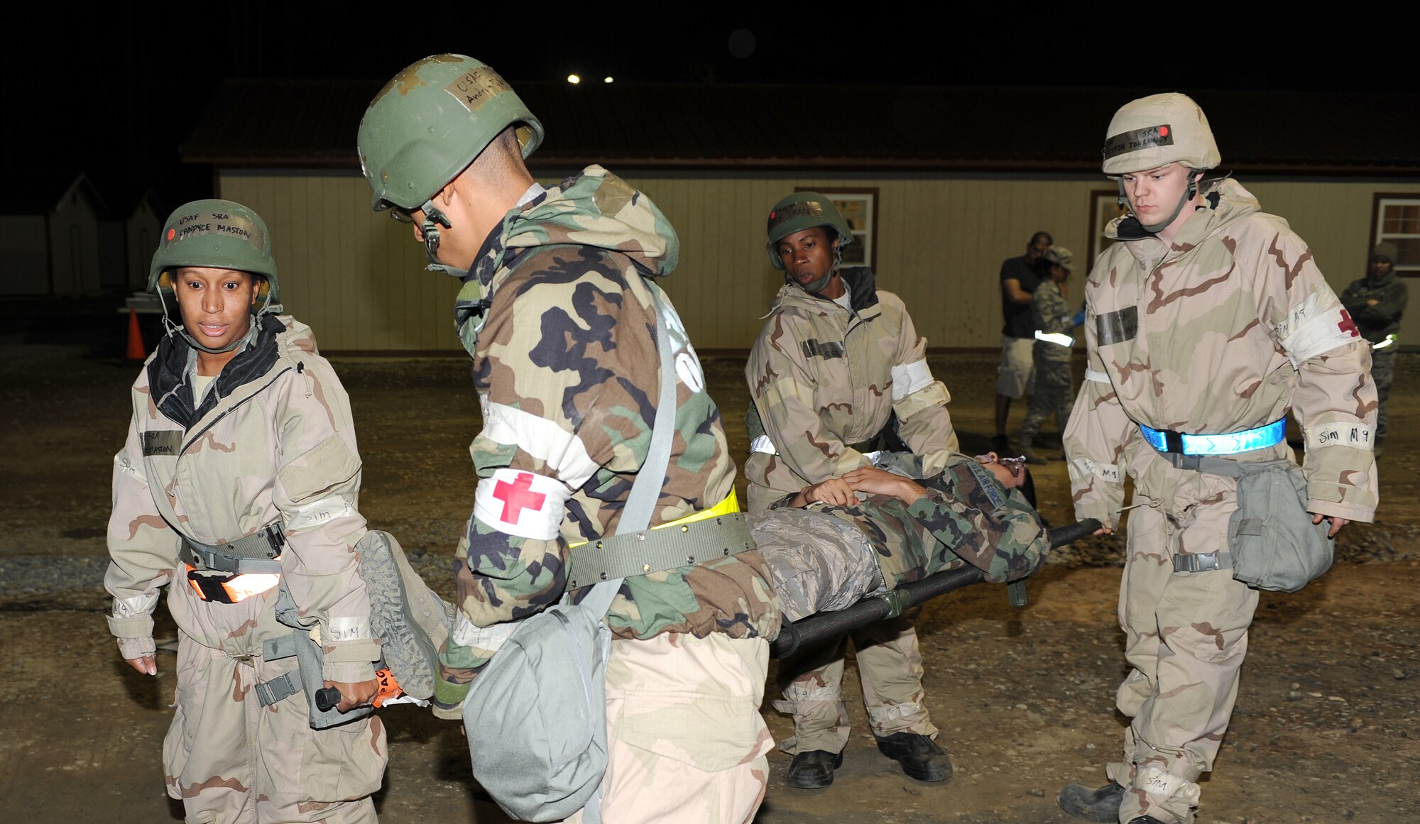 Airmen from the 633rd Medical Group carry a simulated victim on a litter during the phase II operational readiness exercise at Langley Air Force Base, Va., April 19, 2012. A phase II ORE is designed to prepare Airmen for deployed operations. (U.S. Air Force photo by Airman 1st Class Teresa Cleveland/Released)