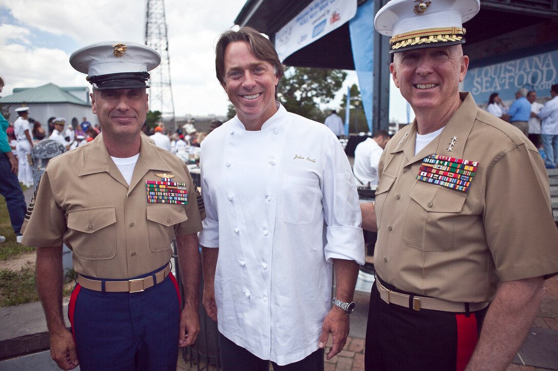 Lt. Gen. Steven A. Hummer, commander of Marine Forces Reserve and Marine Forces North, and Sgt. Maj. James E. Booker, MARFORRES sergeant major,  gather with John Besh, an award-winning chef, during the Louisiana Seafood Cook-Off, April 20, 2012. The cook-off was held as part of the War of 1812 Commemoration. New Orleans will serve as the inaugural city in a three-year national celebration commemorating the War of 1812 and the Star-Spangled Banner. The Marine Corps’ role in this event reinforces its naval character, showcases the Navy-Marine Corps team and highlights the military’s enduring relationship with the city of New Orleans.  (U.S. Marine Corps photo by Lance Cpl. Marcin Platek/Released)