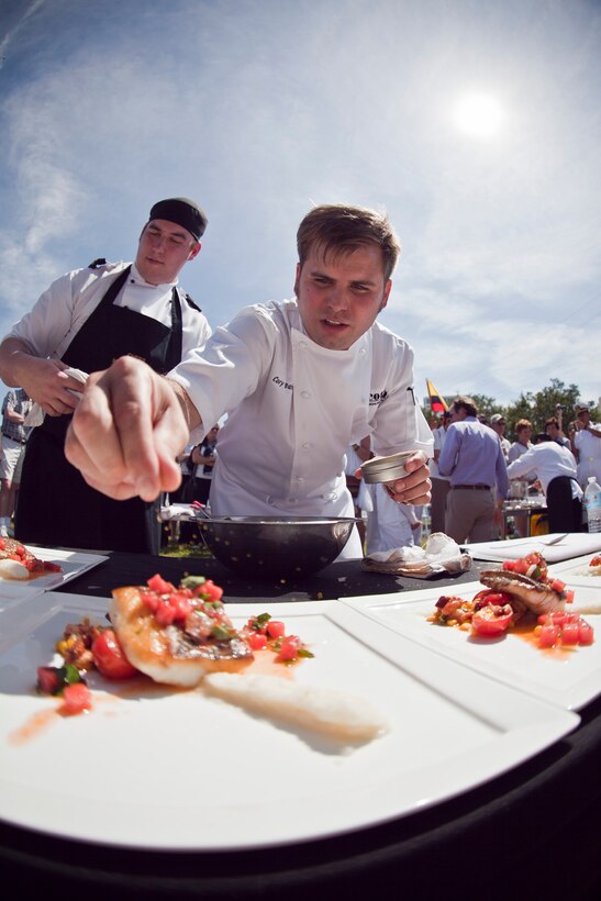Cory Bahr, the executive chef at Restaurant Sage, prepares a dish during the Louisiana Seafood Cook-Off, April 20, 2012. The cook-off was held as part of the War of 1812 Commemoration. New Orleans will serve as the inaugural city in a three-year national celebration commemorating the War of 1812 and the Star-Spangled Banner. The Marine Corps’ role in this event reinforces its naval character, showcases the Navy-Marine Corps team and highlights the military’s enduring relationship with the city of New Orleans. (U.S. Marine Corps photo by Lance Cpl. Marcin Platek/Released)