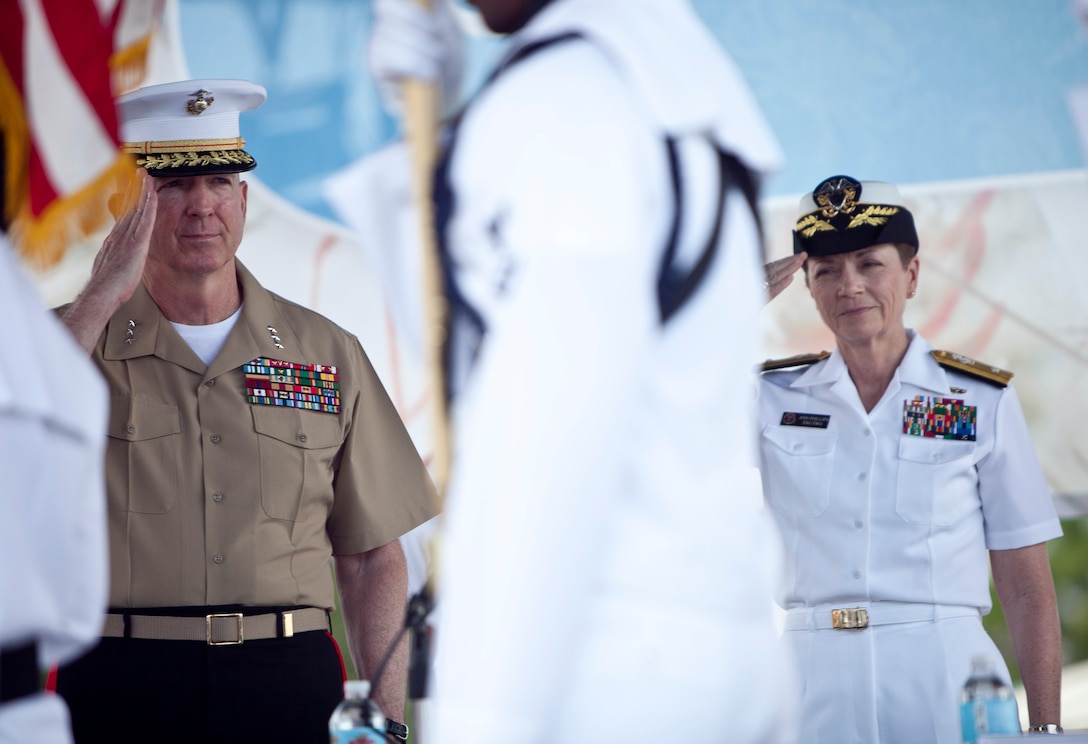 Lt. Gen. Steven A. Hummer, commander of Marine Forces Reserve and Marine Forces North, and Navy Rear Adm. Anne Clair Phillips, commander of Expeditionary Strike Group Two, salute the national colors during the Louisiana Seafood Cook-Off, April 20, 2012. The cook-off was held as part of the War of 1812 Commemoration. New Orleans will serve as the inaugural city in a three-year national celebration commemorating the War of 1812 and the Star-Spangled Banner. The Marine Corps’ role in this event reinforces its naval character, showcases the Navy-Marine Corps team and highlights the military’s enduring relationship with the city of New Orleans.  (U.S. Marine Corps photo by Lance Cpl. Marcin Platek/Released)