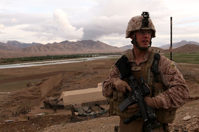 Captain Joshua B. Kling, commanding officer of Golf Battery, 2nd Battalion, 11th Marine Regiment, inspects the post here, April 20, 2012. Marine and Afghan National Army officials toured the observation post, which is the northernmost Marine position in Kajaki. (U.S. Marine Corps photo by Lance Cpl. Tyler Reiriz)