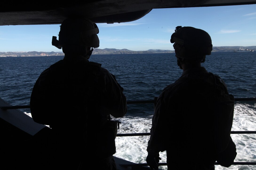 Marines with 2nd Platoon, Charlie Company, Battalion Landing Team 1st Battalion, 2nd Marine Regiment, 24th Marine Expeditionary Unit, provide ship security during Defense of Amphibious Task Force operations, April 20, 2012, as the ship sails through the Strait of Gibraltar. The 24th MEU, partnered with the Navy's Iwo Jima Amphibious Ready Group, is currently deployed as a theater reserve and crisis response force capable of a variety of missions from full-scale combat operations to humanitarian assistance and disaster relief.