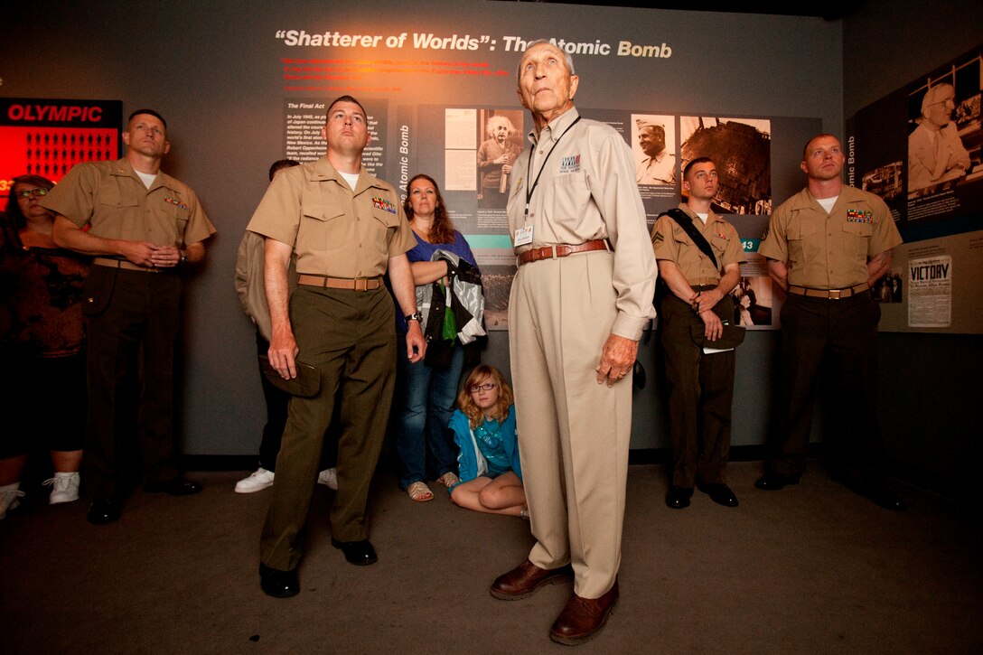 Bert Stolier, a Marine Raider who volunteers at the National World War II Museum in New Orleans and a group of 26th Marine Expeditionary Unit Marines look on as a video about the war in the Pacific plays, April 21, 2012. The 26th MEU is providing support to the commemoration of the Battle of New Orleans. Starting April and continuing through 2015, the Navy, Marine Corps, and Coast Guard will commemorate the Bicentennial of the War of 1812 and the Star Spangled Banner. The War of 1812 celebration will commemorate the rich Naval history and showcase the capabilities of today's Navy-Marine Corps team. (Official Marine Corps photo by Lance Cpl. Scott L. Tomaszycki)