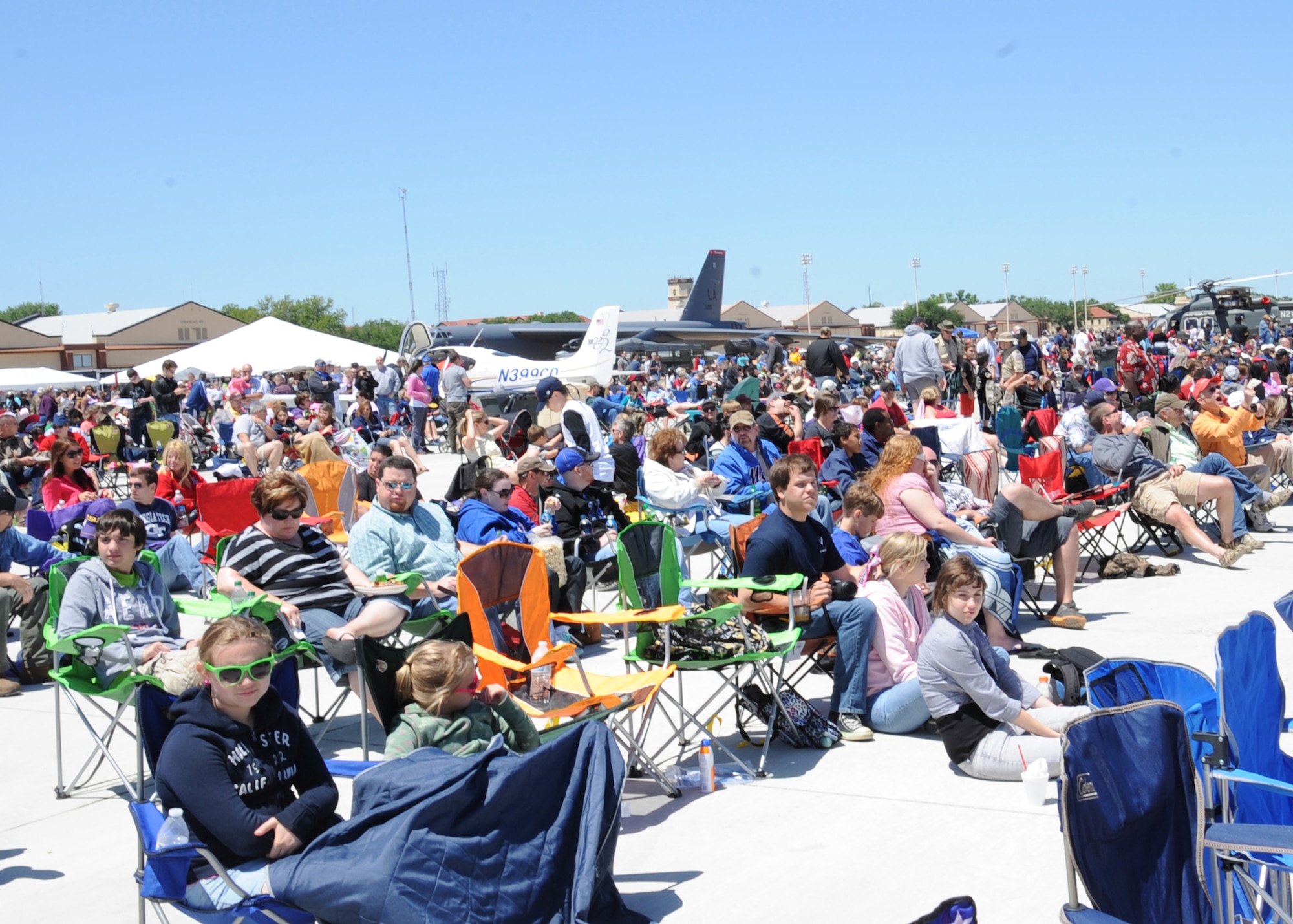 BARKSDALE AIR FORCE BASE, La. -- Visitors attending the Barksdale Air Force Base 2012 Defenders of Liberty Air Show wait for the next act April 21. Visitors came to see various aerial demonstrations perform including the Black Diamond Jet Team and the Air Force Thunderbirds. (U.S. Air force photo/Senior Airman Sean Martin) (Released)