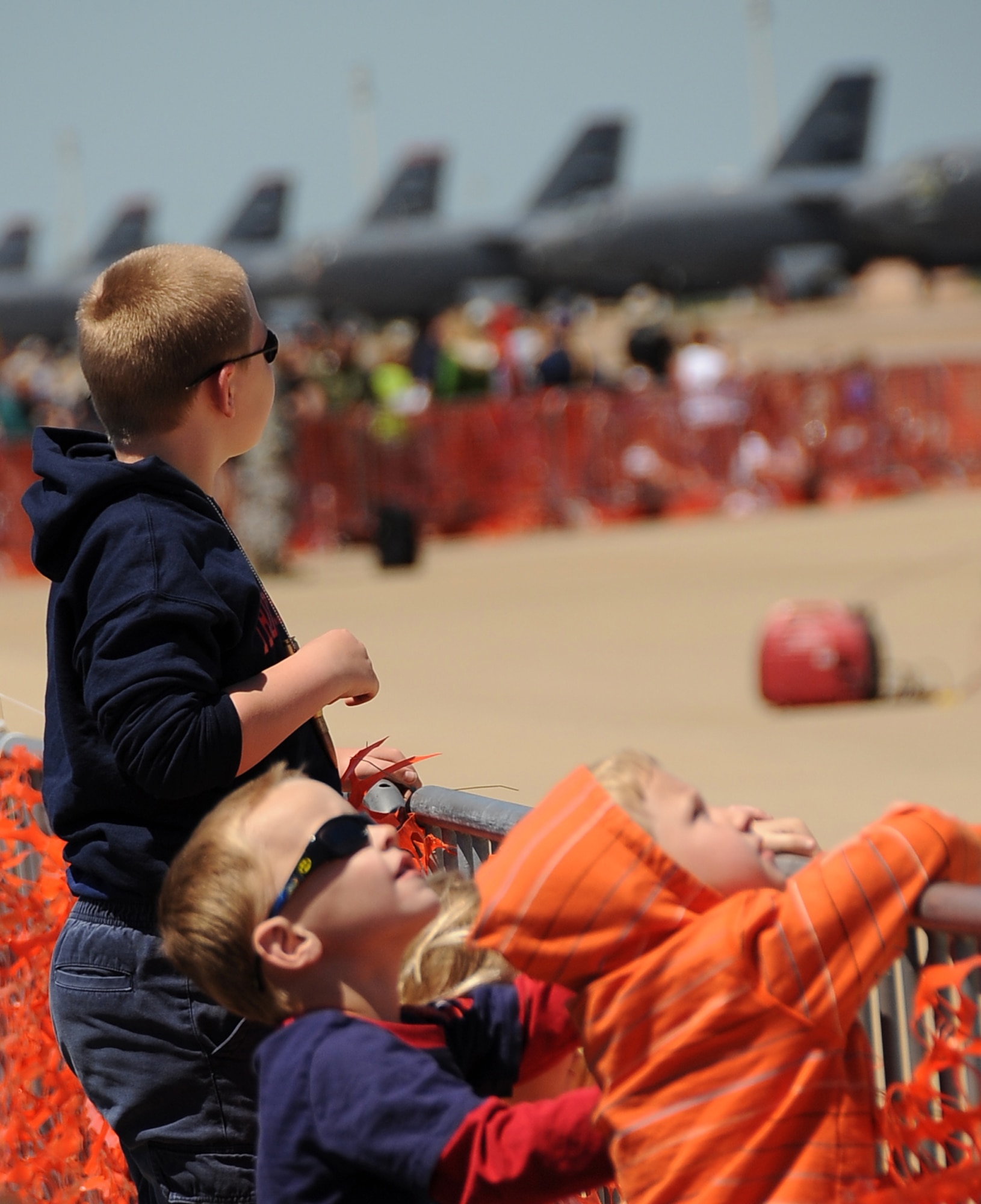 Children watch as Mig 17 demo pilot, Randy Ball, passes overhead during the Defenders of Liberty 2012 Air Show on Barksdale Air Force Base, La., April 21. More than 20 aerial acts were presented to the crowd throughout the air show, headlined by the U.S. Air Force Thunderbirds. (U.S. Air Force photo/Staff Sgt. Amber Ashcraft) (RELEASED)