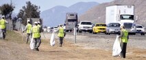 Twenty members of the 912th Air Refueling Squadron pick up litter along the southbound I-215 between the Cactus exit and just past the Van Buren exit for their inaugural litter removal after adopting a highway through Caltrans' Adopt-A-Highway program.  (U.S. Air Force photo by Megan Crusher)