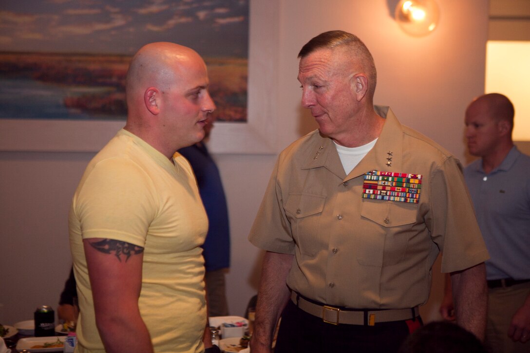 Lt. Gen. Steven A. Hummer, commander of Marine Forces Reserve and Marine Forces North, talks with Sgt. Ballard Hall, a Wounded Warrior from Biloxi, Mo., at a John Besh Luncheon at Borgne Restaurant, April 21, 2012. The Wounded Warriors visited the city for the festivities of the Commemoration of War of 1812. New Orleans will serve as the inaugural city in a three-year national celebration commemorating the War of 1812 and the Star-Spangled Banner. The Marine Corps’ role in this event reinforces its naval character, showcases the Navy-Marine Corps team and highlights the military’s enduring relationship with the city of New Orleans. (U.S. Marine Corps photo by Lance Cpl. Marcin Platek/Released)