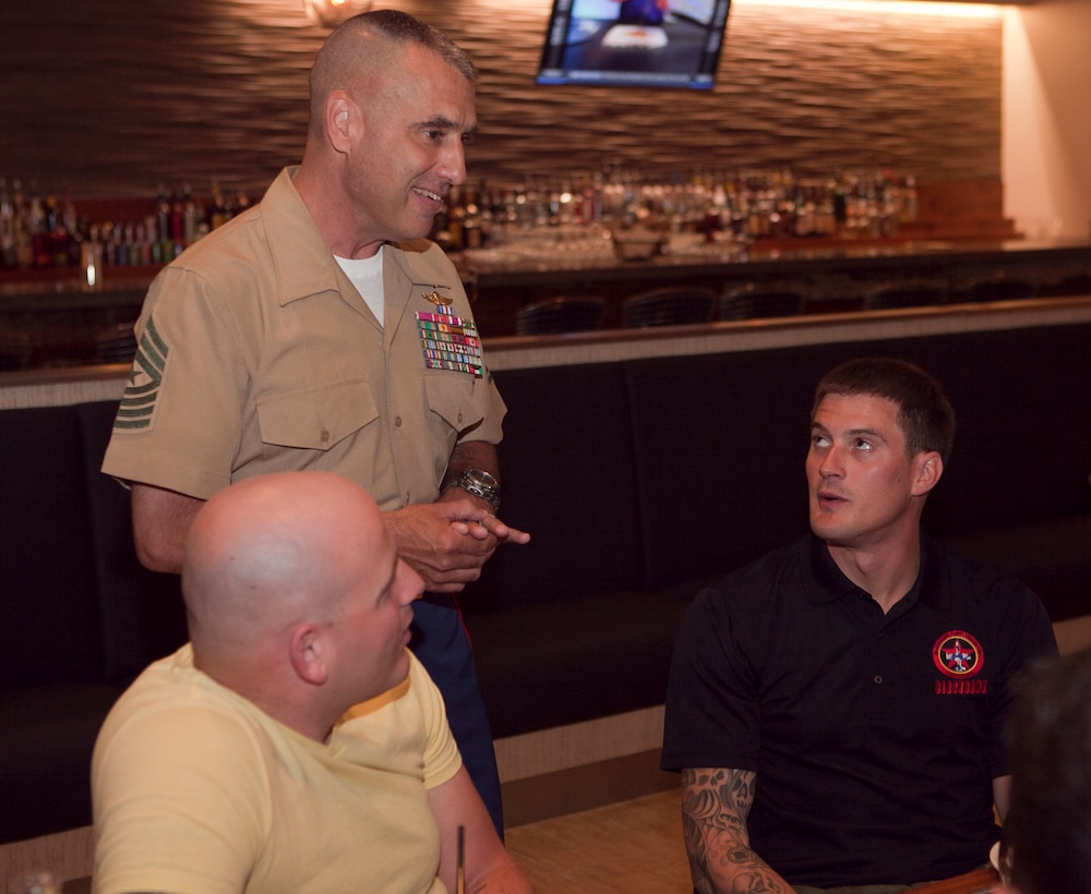 Sgt. Maj. James E. Booker, Marine Forces Reserve sergeant major, talks with Sgt. Ballard Hall, Wounded Warrior from Biloxi, Mo., and Lance Cpl., Eric Des Biens, Wounded Warrior from Killingworth, Conn., at a John Besh Luncheon at Borgne Restaurant, April 21, 2012. The Wounded Warriors visited the city for the festivities of the Commemoration of War of 1812. New Orleans will serve as the inaugural city in a three-year national celebration commemorating the War of 1812 and the Star-Spangled Banner. The Marine Corps’ role in this event reinforces its naval character, showcases the Navy-Marine Corps team and highlights the military’s enduring relationship with the city of New Orleans. (U.S. Marine Corps photo by Lance Cpl. Marcin Platek/Released)