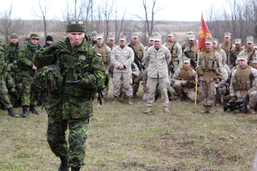 Lt. Col. D.R. Stepaniuk, commanding officer, Royal Hamilton Light Infantry from Hamilton, Ontario, speaks to Marines with Company I, 3rd Battalion, 25th Marine Regiment, based out of Buffalo, N.Y. and RHLI Canadian Soldiers during a mass formation prior to the start of a small-scale, 48-hour, bilateral exercise between the two militaries April 20-22.  The purpose of the training was to exchange infantry strategies and tactics as well as further enhance relationships and interoperability between the two military components.  (U.S. Marine Corps Photo by Cpl. Lucas Vega)