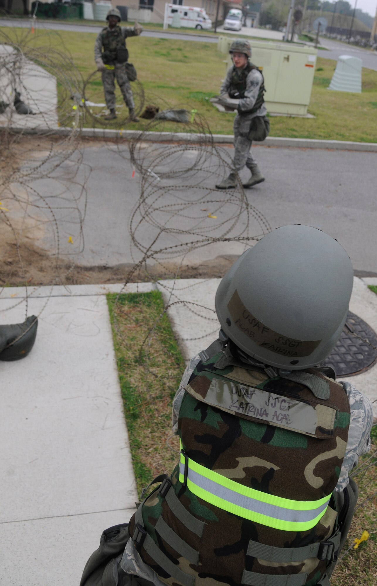 Staff Sergeant Katrina Acab and Senior Airman Jason Debelevich, 8th Communications Squadron members, unwind concertina-wire during exercise Beverly Midnight 12-02 at Kunsan Air Base, Republic of Korea, April 23, 2012. The Wolf Pack will find out results of the consolidated unit inspection May 2 once the inspection is complete and the IG has written their report. (U.S. Air Force photo/Staff Sgt. Rasheen A. Douglas)