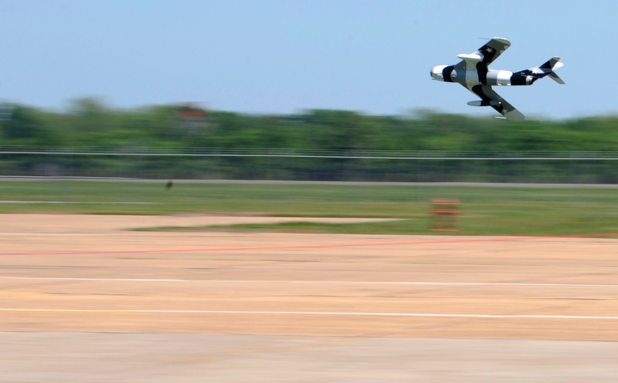 A pilot from the Black Diamond Jet Team flies his Aero L-39 Albatros low across the base flightline during the 2012 Barksdale Air Force Base Defenders of Liberty Air Show April 21. The Black Diamond Jet Team was one of several aerial acts that performed during the air show, headlined by the U.S. Air Force Thunderbirds. (U.S. Air Force photo/Airman 1st Class Joseph A. Pagán Jr.)(RELEASED)