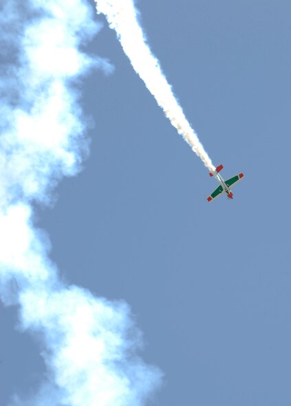 Kevin Coleman performs stunts in his Extra 300S aircraft over the base flightline during the 2012 Barksdale Air Force Base Defenders of Liberty Air Show April 21. Coleman's performance was one of several aerial acts that performed during the air show, headlined by the U.S. Air Force Thunderbirds. (U.S. Air Force photo/Airman 1st Class Joseph A. Pagán Jr.)(RELEASED)