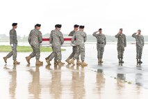 A U.S. Army carry team transfers the remains of a U.S. Army soldier, at Dover Air Force Base, Del., April 22, 2012. The soldier was one of four who died supporting Operation Enduring Freedom in Afghanistan. They were assigned to A Company, 2nd Battalion, 25th Aviation Regiment, 25th Combat Aviation Brigade, Wheeler Army Airfield, Hawaii. (U.S. Air Force photo/Roland Balik)
