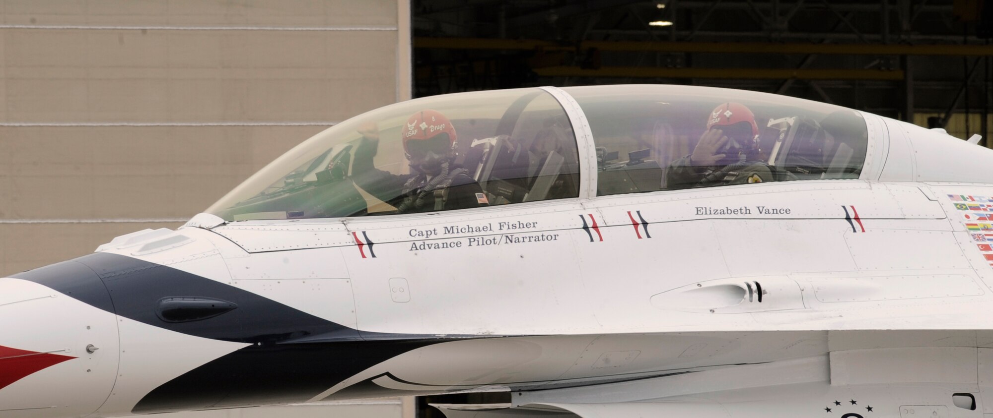Thunderbirds pilot Capt. Michael Fisher and Elizabeth Vance, Cope Middle School 7th grade science teacher, wave goodbye before taking off on Barksdale Air Force Base, La., April 21. Vance, who received the title of Hometown Hero for being the best middle school teacher in Louisiana, was given the opportunity to fly with a Thunderbirds pilot. (U.S. Air Force photo/Airman 1st Class Benjamin Gonsier)(RELEASED)