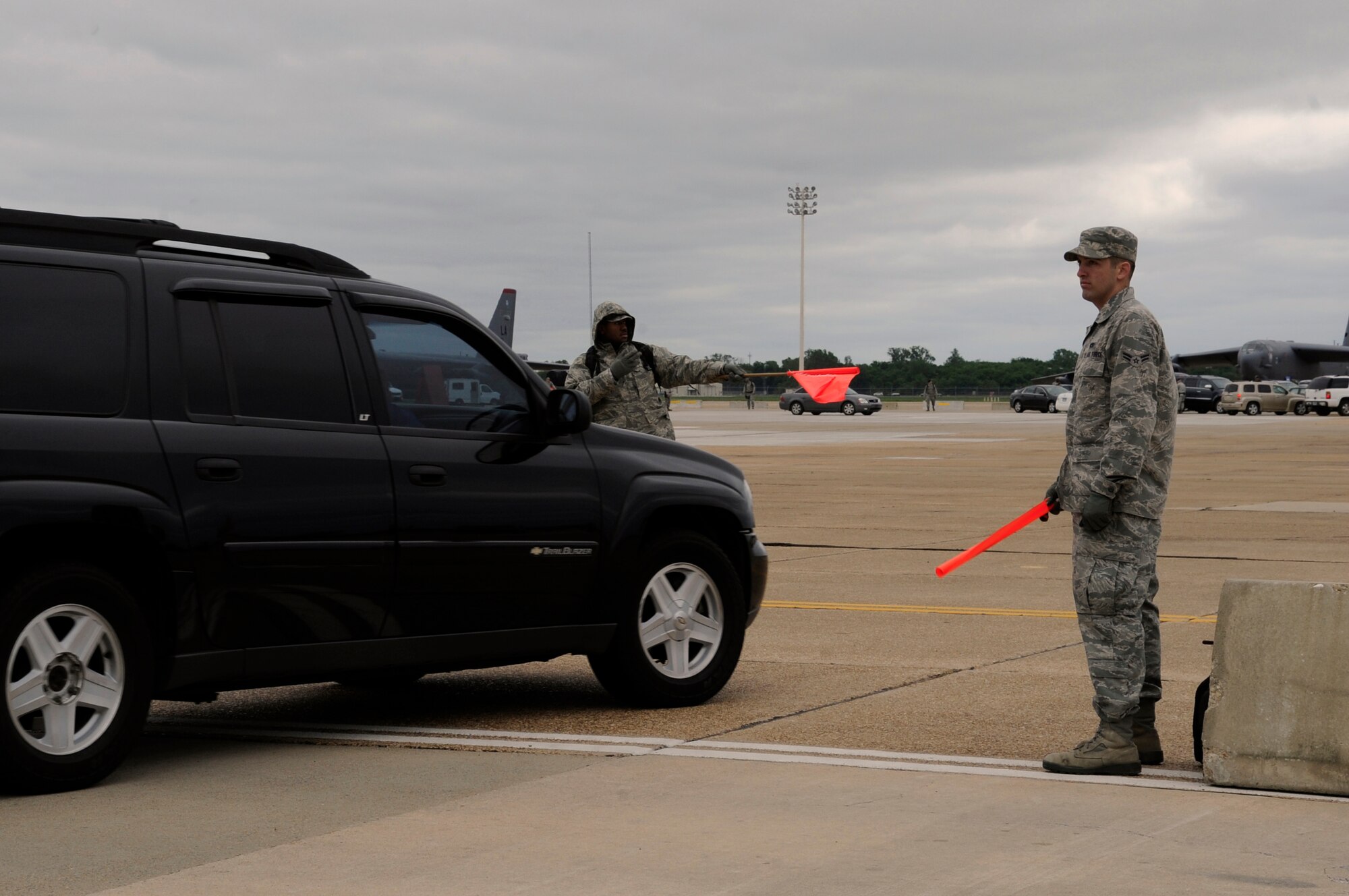 Barksdale Airmen help direct traffic during the air show on Barksdale Air Force Base, La., April 21. The Barksdale Air Force Base 2012 Defenders of Liberty Air Show was held April 21-22 and was open to the public. (U.S. Air Force photo/Airman 1st Class Benjamin Gonsier)(RELEASED)