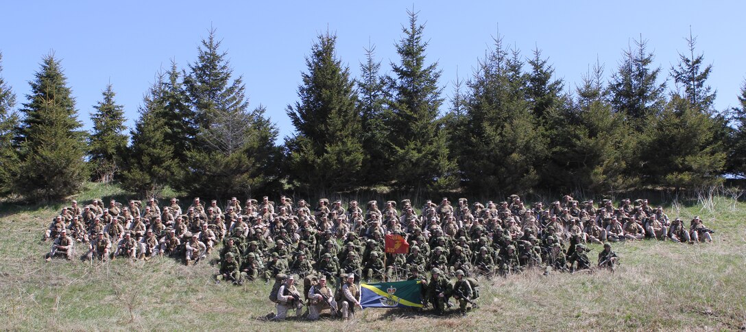 Marines with Company I, 3rd Battalion, 25th Marine Regiment, from  Buffalo, N.Y. and soldiers with The Royal Hamilton Light Infantry, Canadian Forces pose for a photo April 22 following the completion of a small-scale, 48-hour, bilateral exercise between the U.S. Marine Corps and Canadian Forces.  The purpose of the training was to exchange infantry strategies and tactics in efforts to further enhance relationships and interoperability between the two military components. (U.S. Marine Corps Photo by Cpl. Lucas Vega)