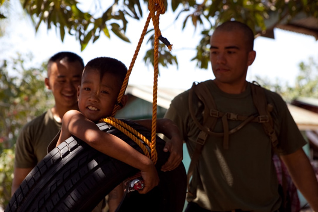 Jacob Laurel, 9, swings on a tire recently hung by Armed Forces of the Philippines and U. S. service members in his village of Santa Juliana, April 23. Together with villagers and Armed Forces of the Philippines service members, Marines repaired two water pumps, hung tire swings in common areas, renovated the schoolhouse and donated books and school supplies to children in need during Exercise Balikatan 2012. Balikatan, which means "shoulder to shoulder" in Filipino, is an annual training event aimed at improving combined planning, combat readiness, humanitarian assistance and interoperability between the Armed Forces of the Philippines and United States