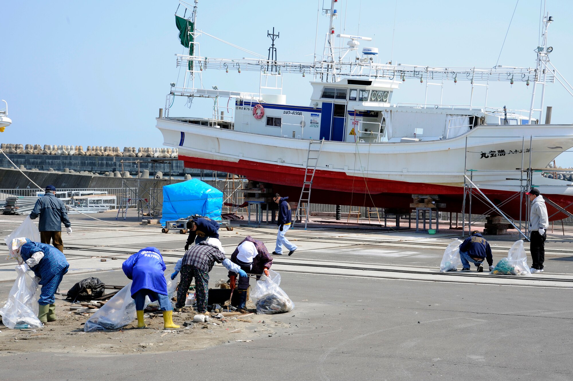 A ship rests as military members and their dependents joined members from the local community to clean up the Misawa City Port in Misawa City, Japan, April 21, 2012. The event was led by Misawa City and the 35th Civil Engineer Squadron environmental management office to encourage public interest in protecting the environment in recognition of Earth Day. (U.S. Air Force photo by Tech. Sgt. Marie Brown/Released)

