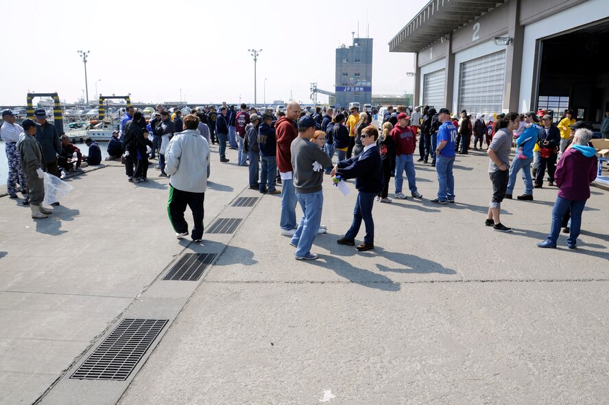 Military members and their dependents gathered at the Misawa City Port with members from the local community to participate in the 14th Annual Misawa City Port Clean-up in Misawa City, Japan, April 21, 2012. More than 300 volunteers attended the 14th annual clean-up effort. The event was led by Misawa City and the 35th Civil Engineer Squadron environmental management office to encourage public interest in protecting the environment in recognition of Earth Day. (U.S. Air Force photo by Tech. Sgt. Marie Brown/Released)