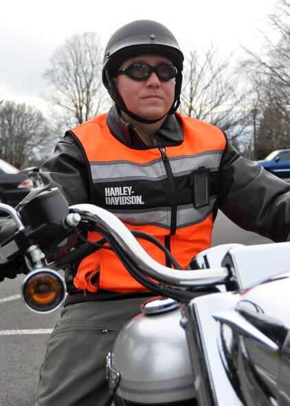Lt. Col. Jason King, 62nd Airlift Wing chief of safety, prepares for an afternoon motorcycle ride April 10, 2012, at Joint Base Lewis-McChord, Wash. Prior to riding, servicemembers must attend and complete required motorcycle training. In accordance with Department of Defense Instruction 6055.04, “DOD Traffic Safety Program,” an appropriate Motorcycle Safety Foundation course must be taken. (U.S. Air Force photo/Senior Airman Leah Young)