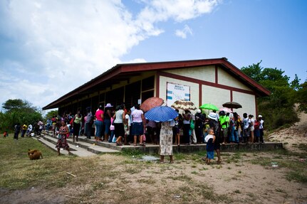 BATALLA, Honduras -- Local community members in the municipality of Batalla line up outside of a local school, waiting to be seen during Joint Task Force-Bravo's most recent medical readiness and training exercise. In partnership with the Honduran Ministry of Health and Honduran Military, JTF-Bravo delivered medical care to 1,774 patients in Batalla and Wawina during the MEDRETE, April 18-21. (U.S. Air Force Photo/1st Lt. Christopher Diaz)