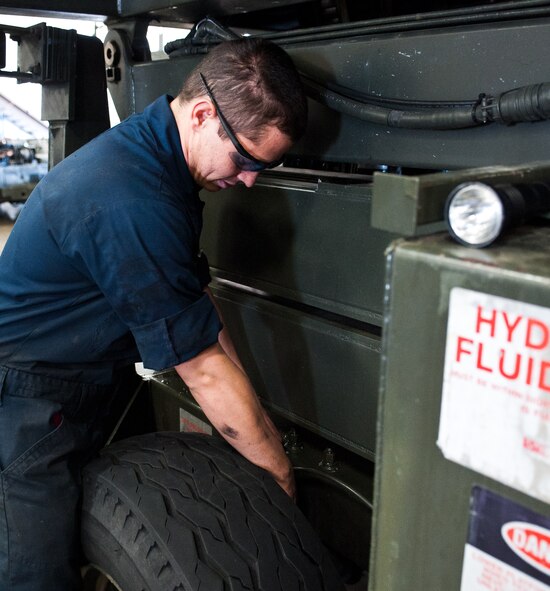 Airman 1st Class Jeffrey Mendenhall, 28th Maintenance Squadron aerospace ground equipment technician, adjusts the brakes on a universal maintenance stand during scheduled maintenance at Ellsworth Air Force Base, S.D., April 18, 2012. These brakes are serviced periodically to ensure safety and serviceability. (U.S. Air Force photo by Airman 1st Class Alystria Maurer/Released)