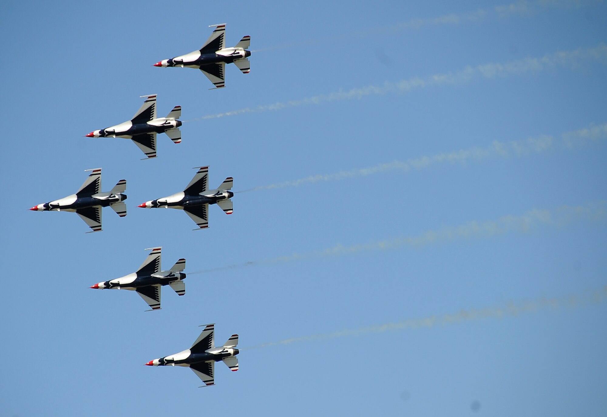 The Thunderbirds F-16 Fighting Falcons pass over the crowd during the 2012 Barksdale Air Force Base Defenders of Liberty Air Show April 21. The Air Force Air Demonstration Squadron Thunderbirds, based at Nellis Air Force Base, Nev., is the Air Force's premier aerial demonstration team, performing at air shows and special events worldwide. (U.S. Air Force photo/Staff Sgt. Amber Ashcraft) (RELEASED)
