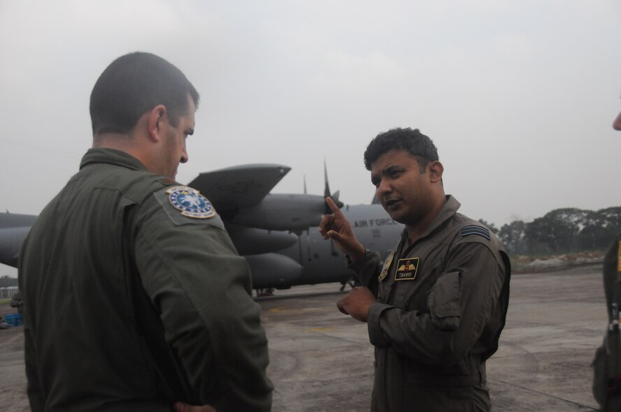KURMITOLA AIR BASE, Bangladesh -- U.S. Air Force Maj. Matt Quenichet, Cope South mission commander, Kentucky Air National Guard, speaks with Bangladesh Air Force Tanvir Reza, 101 Special Flying Unit Squadron commander before the kickoff of Cope South 2012 at Kurmitola Air Base, Bangladesh, April 21, 2012. Cope South 2012 helps cultivate common bonds, foster goodwill and improve readiness and interoperability between members of the Bangladesh and U.S. Air Force. (U.S. Air Force photo by 1st Lt Cammie Quinn)
